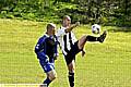THAT’S MINE: Anthony Healey, of Halfway House, clears from Adam Darlington of Springbank. 