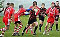 ON THE CHARGE: Billy McDermott, of Oldham Service Area under-12s, attempts to break through the Wigan and Leigh line.