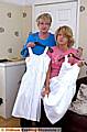EMBARRASSED . . . Andrea and her mum Kathleen with two of the dresses 