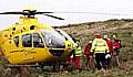 AIR alert . . . medics prepare to air-lift the injured man to hospital 
