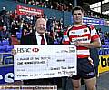 CONGRATULATIONS: Spindles and Town Square manager Mike Flanagan (left) presents Roughyeds star Dave Allen with his prize. 