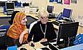 NEVER too old to learn . . . Julie Goodyear is taught to use a computer with help from IT tutor Thara Parveen 

