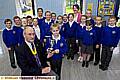 WORTHY winners . . . Philip Hibbert, vice-president of the Rotary Club of Oldham Metro, presents the trophy to Elicia Rawsthorne, watched by fellow St Hugh’s pupils who took part and teacher Karen Barton 