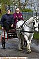GIDDY up . . . the Bishop of Manchester takes the reigns on a horse and cart with Trent Riding Stables proprietor Esme Hernon 
