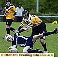 OVER YOU GO: Josh Bradbury of Saddleworth School is thrown to the ground. 