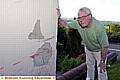 CRUNCH . . . Alan Sweeting shows the damge to his house from the latest accident 