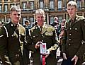 Raymond Burke (centre) pictured with Army colleagues after receiving his MBE 