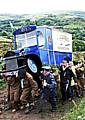 LONG haul . . . Walkers reach Lark Hill with a heavy load 