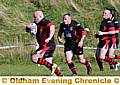 ON THE RUN: Higginshaw's Michael Cadd takes the ball forward against Blackpool.