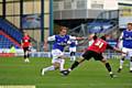 Lewis Alessandra attempts to side-step a Colchester challenge. 