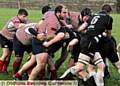 GET STUCK IN . . . Oldham’s forwards confront Workington’s pack. 