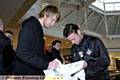 GETTING SHIRTY . . . Athletic boss Paul Dickov signs an Athletic top for Todd Mowers.