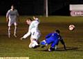 GROUNDED . . . Mossley’s Matty Kay takes a tumble in a challenge with a Curzon Ashton player.