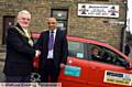 Mayor of Oldham Councillor Jim McArdle with Cartax owner Farooq Yousaf and driver Stephen Fowles. 