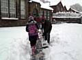 MAKING tracks . . . staff and parents mucked in to clear the way for pupils to get to school safely 