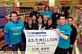 WE did it . . . (front, from left) RNID external affairs officer Jack Colson, Elaine Morgan (store manager) and staff member Jay Muselle 