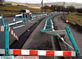 Smashing time . . . barriers on the road from Denshaw 