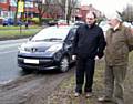 RUINED . . . Councillors Philip Rogers (left) and Jack Hulme inspect the damaged verges 
