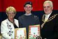 AWARD winner . . . . Cadet Sgt Christopher Hall with Mayor and Mayoress of Oldham, Councillor Jim McArdle and Councillor Kay Knox 