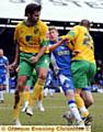 OUCH! Athletic midfielder Joe Colbeck is caught in a Norwich City sandwich.