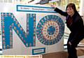 COLOURFUL message . . . NHS Oldham chief executive Gail Richards with the poster designed by pupils from St John’s Primary School, Failsworth. 