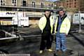James Tindall (left) and Mick Winterbottom from a specialist asbestos-removal firm start work on the derelict care home 
