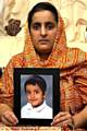 COME home . . . tearful Akila Naqqash clings to a picture of kidnapped son, Sahil 
