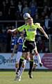 jump for it: Athletic midfielder Dale Stephens goes up for a header. 