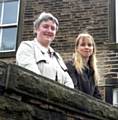 SHOP fight . . . Sharron McGladdery and Heidy Ackroyd pictured outside the former post office in Denshaw 