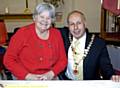 CHANGEOVER . . . Outgoing chairman Councillor Mari Wiswell hands over the reigns of power to new chairman Councillor John Hall 