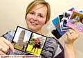 Louise Sever with some of her postcards designed on her new website 
