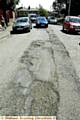 CRUMBLING . . . Potholes in Westway 