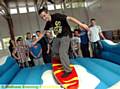 RIDING “the waves” . . . Jake Jackson tackles the surf board simulator. 