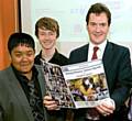 FROM us to you . . . Oldhamer Abdul Momin (left) and Oliver Lunt, from Altrincham, present George Osborne with their Action Agenda 