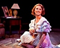 Laura (Katie Moore) in a moment of happiness in Tennessee Williams's The Glass Menagerie 
