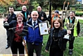 CHAMPIONS (back, from left): greenspace officer Paul Byrne, gardeners Lee Gannon, Geoff Hargreaves, Chris Dyer and Glynn Dyer. Front: Councillor Jean Stretton, greenspace manager Glenn Dale and assistant executive director for environment, Carol Brown 
