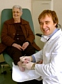 FOOT first . . . Paul Tennant treats Patricia Roberts 
