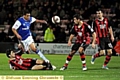 POWER PLAY: Tom Adeyemi shows his strength, but Bournemouth snuff out the danger. 
