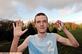 CLEAN SWEEP . . . Adam Howard celebrates after clinching a fifth schools title.