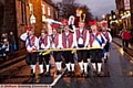 RED nose day . . . morris men take the strain as they pull Father Christmas along the streets of Uppermill. 

