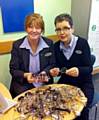 Specsavers employees Trish Hanson (left) and Pam Pickering, sort through donated glasses 