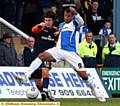 SHOULDER TO SHOULDER . . . Athletic full-back Kieran Lee and Rene Howe, of Bristol Rovers, battle for the ball. 

