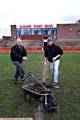 PAYBACK time ... Darren Young (above, left), helps out Oldham Rugby Club groundsman Alan Hollingsworth. 