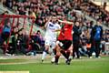 TWO AGAINST ONE . . . Athletic forward Filipe Morais finds himself outnumbered close to the touchline. 
