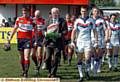 TIME FOR REFLECTION: Roger Halstead (centre) leads Oldham and Rochdale Hornets out. With him (far left) is Chris Clarke, the late Colin's son. PICTURE by ANTHONY MILLER. 
