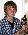MARKSMAN . . . James Larty receives his player of the year award. 
