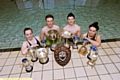 TROPHY POOL... Sarah Loft (left), Harry Entwistle, Brad Ratcliffe and Olivia Askew show off the Oldham Amateur Swimming Club’s silverware. 