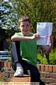 A-STAR: Daniel McLoughlin (13) with his A* GCSE result in maths  