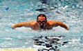 MASTER STROKE. . . . Jamie Kelly scythes through the water.