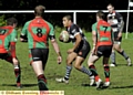 SURROUNDED . . . Junior Brandford, of Saddleworth Rangers, tries to find a way through the Myton Warriors line in the Premier Division clash. 